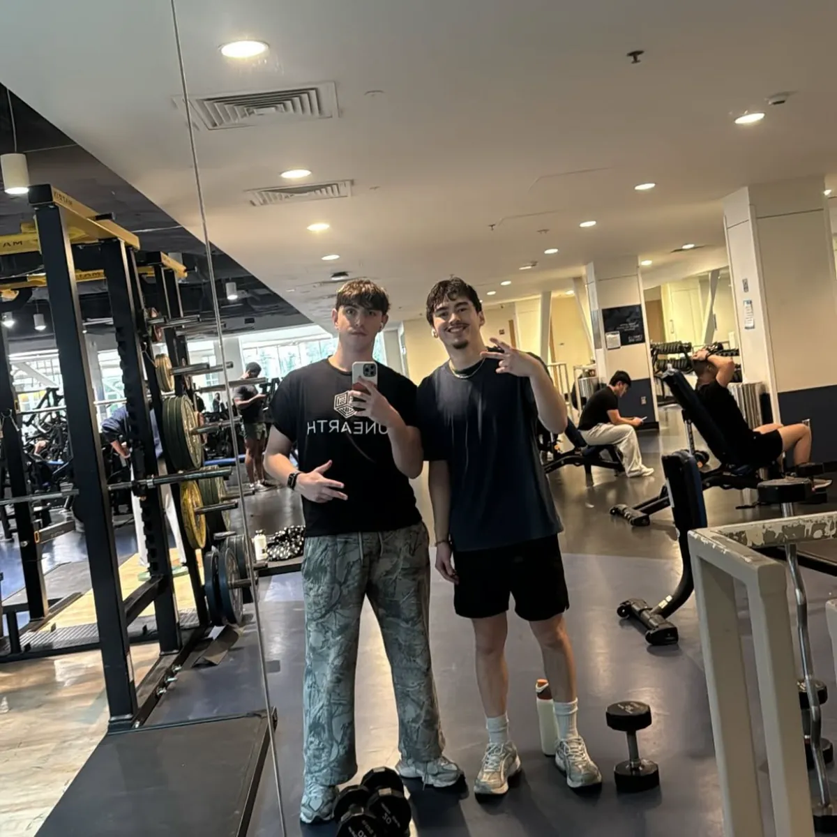 Jayden and a friend in a gym mirror selfie after a workout